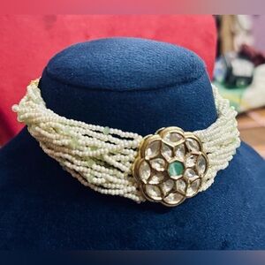 Gold and Green Ornate Necklace with Intricate Metalwork